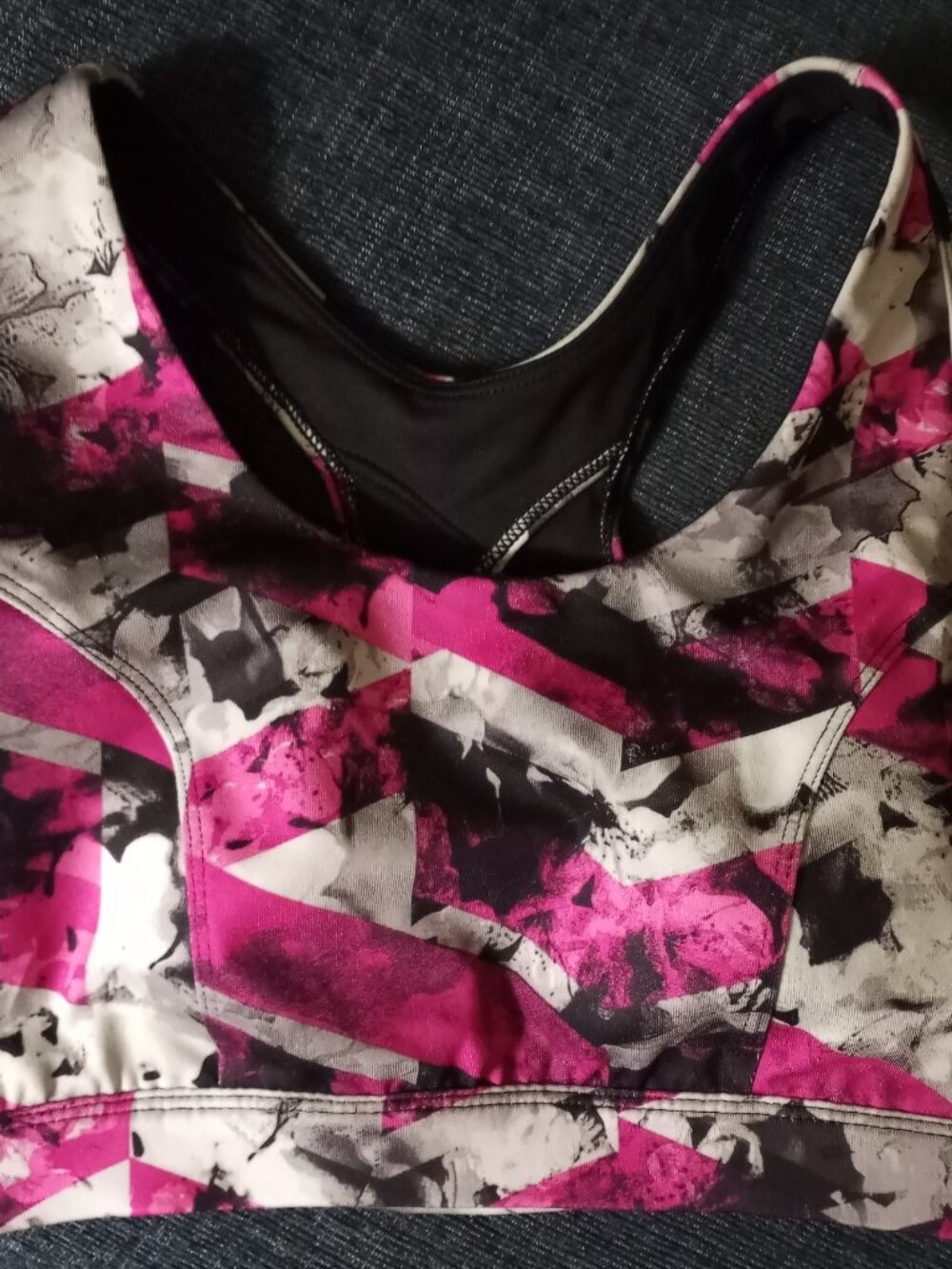 T Gear DryTek sports bra featuring a pink, black, and white abstract geometric p